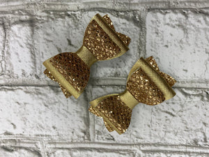 Gold piggy tail bows